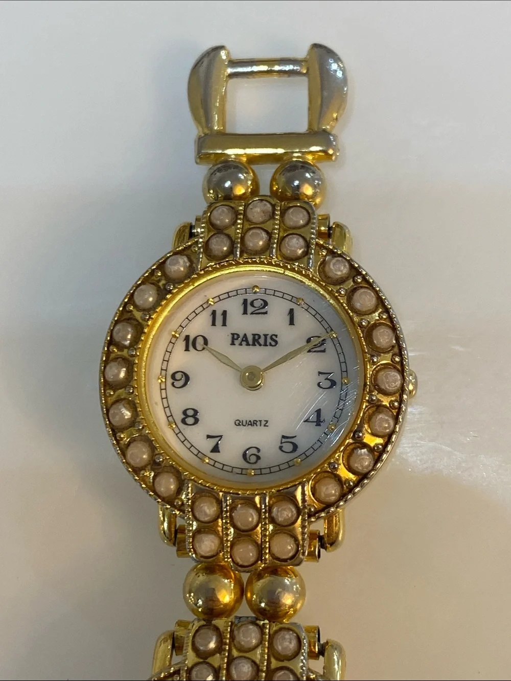 Faux pearl gold tone watch